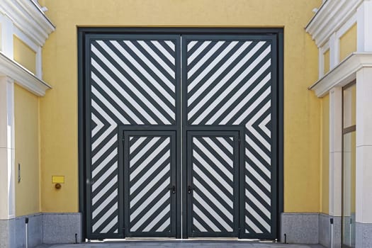 Big double door with diagonal stripe lines