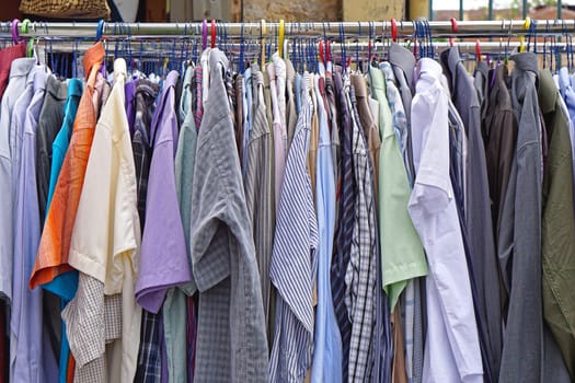 Men shirts hanging at clothes rails