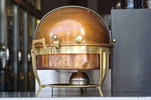 Brass food warmer chafing dish at buffet