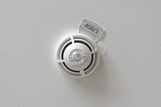 Smoke and fire detector at ceiling