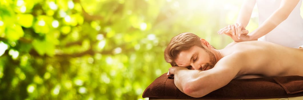 Portrait Of A Young Man Receiving Back Massage At A Beauty Spa