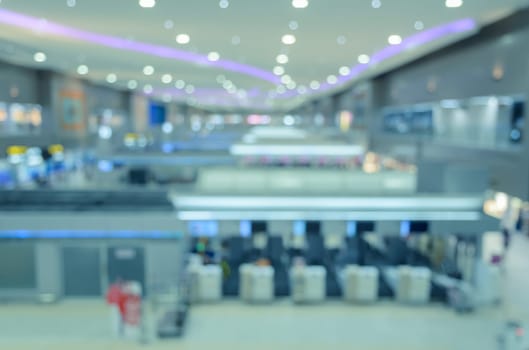 Blurred abstract background of airport check-in hall. Vintage filtered color image.