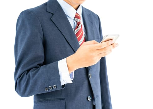 Businessman in suit holding a smartphone over white background