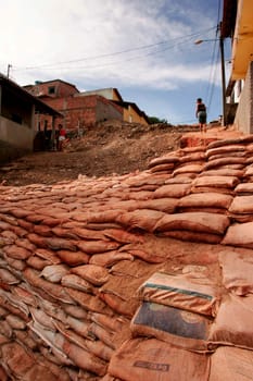 eunapolis, bahia / brazil - april 6, 2010: containment of terrono made of sandbags in the city of Eunapolis, southern Bahia.