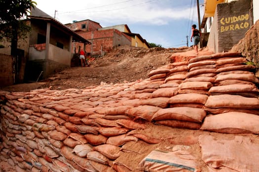 eunapolis, bahia / brazil - april 6, 2010: containment of terrono made of sandbags in the city of Eunapolis, southern Bahia.