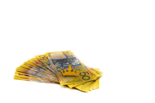Stack of Australian 50 dollars banknotes isolated over white background with copy space, cash is king concept image