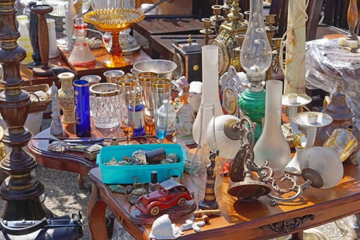 Porcelain ceramic lamps and glasses at flea market