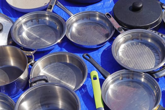 Many stainless steel metal frying pans