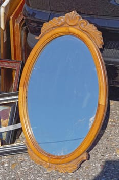 Carved rustic wood oval mirror frame