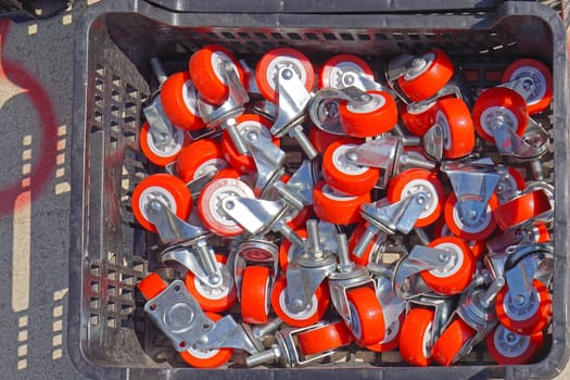 Red wheels parts for carts transport in crate