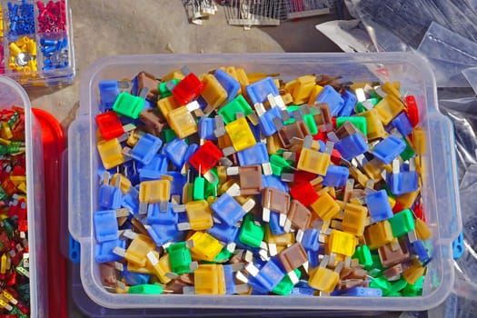 Many color coded fuses for cars in box