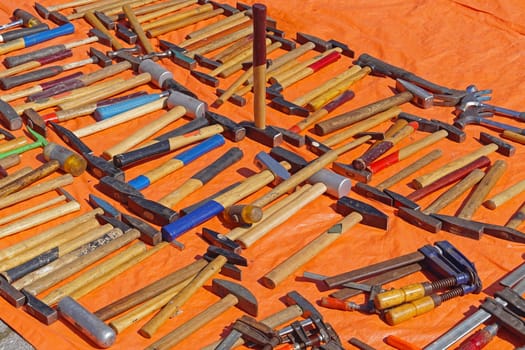 Various shape and sizes of used hammers tools