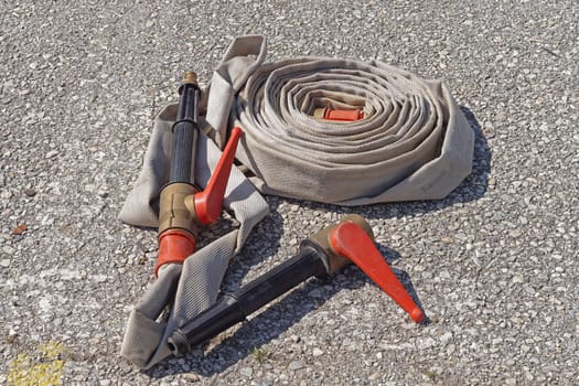 Fire hose with nozzle and valve couplings