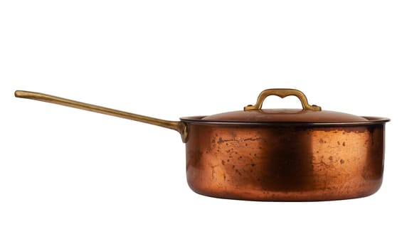 side view closeup of old cooking pan with copper lid and metallic handle isolated on white background