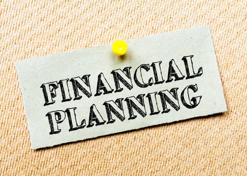 Recycled paper note pinned on cork board. Financial Planning Message. Concept Image
