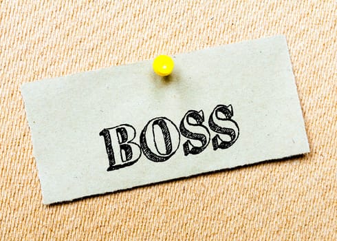 Recycled paper note pinned on cork board. Boss Message. Concept Image