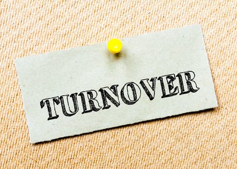 Recycled paper note pinned on cork board.Turnover Message. Concept Image