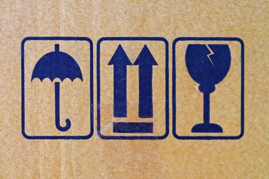 Handle with care at cardboard package box