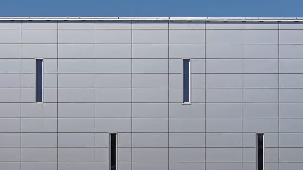 Grey metal panels at commercial building exterior