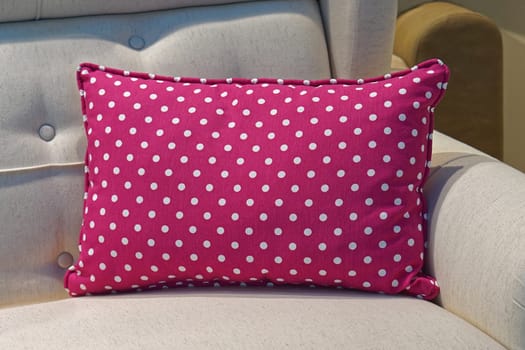 Pink pillow with dot pattern