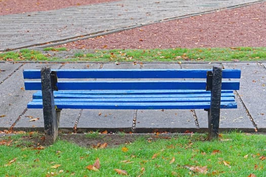 Blue wood bench in city park