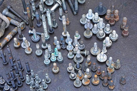 Used screws and nuts in upright position