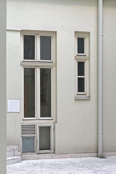 Long vertical windows at white building