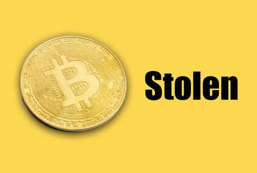 BITCOIN STOLEN text on yellow background. Cryptocurrency theft concept
