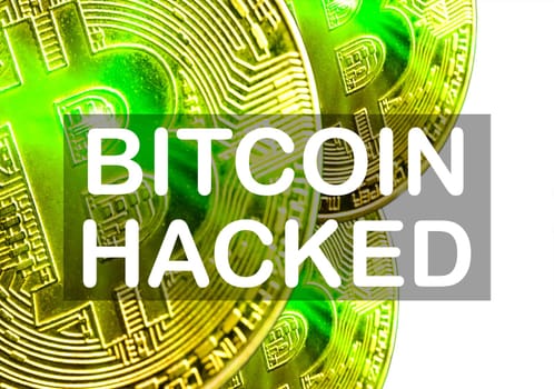 BITCOIN HACKED text on white background. Cryptocurrency theft concept