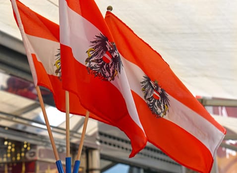 Three Austrian flags with eagles