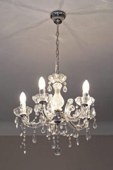 Crystal chandelier with incandescent light bulbs