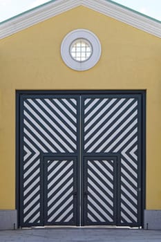 Big double door with diagonal stripe lines