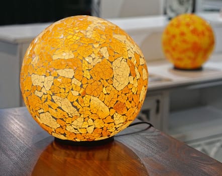 Modern table lamp with glass sphere
