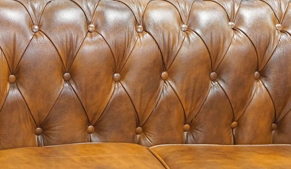 Brown leather sofa backrest upholstery pattern