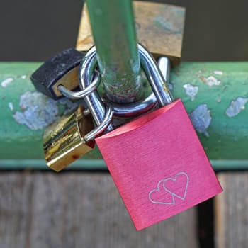 Love locks attached at bridge fence