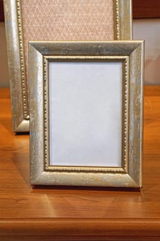 Gold picture frame at table