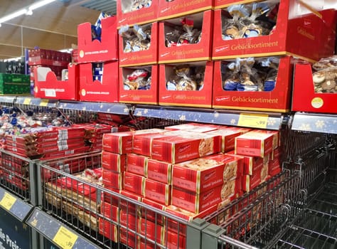 WETZLAR, GERMANY - DEZEMBER 18 2019: Aisle with christmas cookies food products, interior of an ALDI SUED discount supermarket.