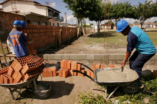 eunapolis, bahia / brazil - september 4, 2010: construction workers are seen working on building a school in the municipality of Eunapolis, in southern Bahia.