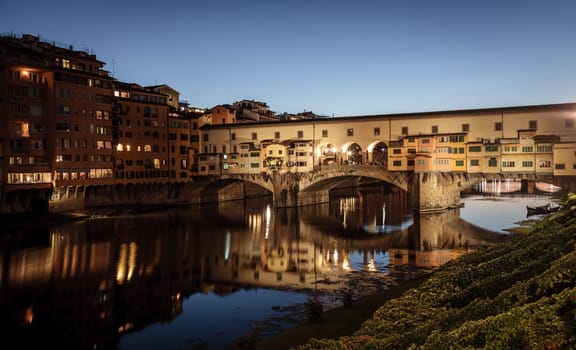 View of the Ponte Vecchio or Old Bridge across the Arno River in Florence, Italy at night