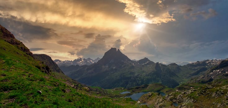 view of Pic du Midi Ossau and Ayous lake in the french Pyrenees mountains