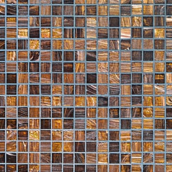 Small square mosaic wall tiles in brown