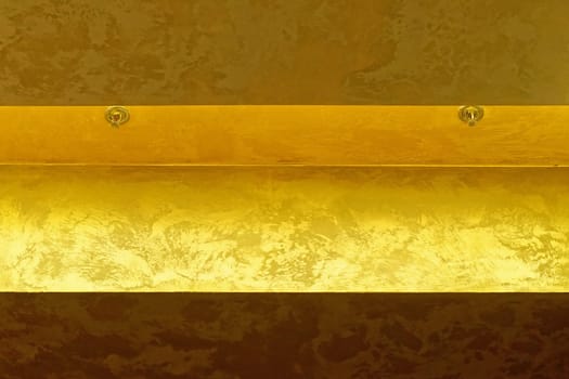 Two fire sprinklers at golden ceiling