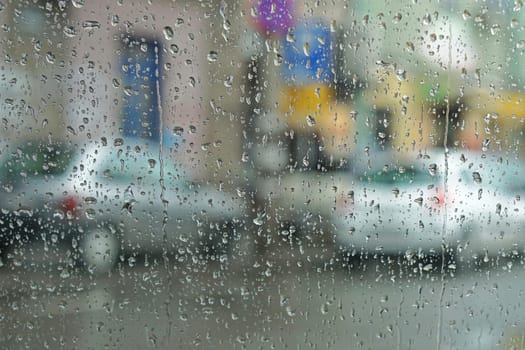 Rainy day abstract weather photo trough wet window