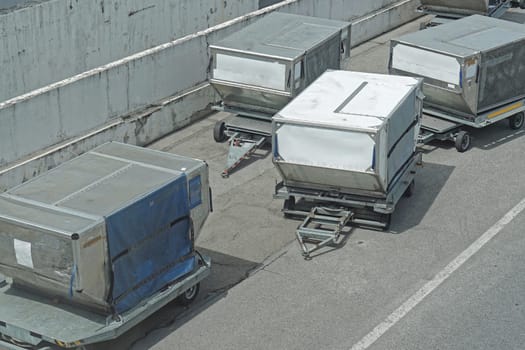 Unit load devices containers at dolly carts at airport