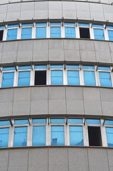 Blue windows at modern gray building