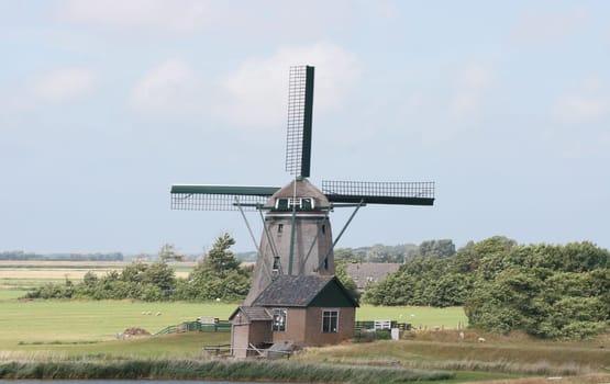 A beautiful old historic windmill, with four wings