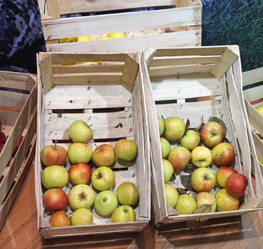 Apples fruits in wooden crates