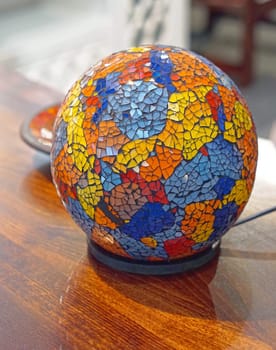 Modern table lamp with glass sphere