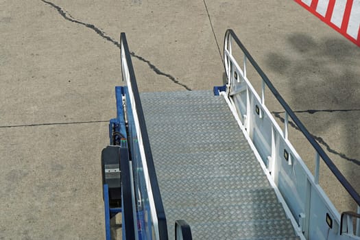 Passenger boarding stairs vehicle at airport