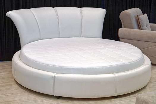 White leather round bed in bedroom